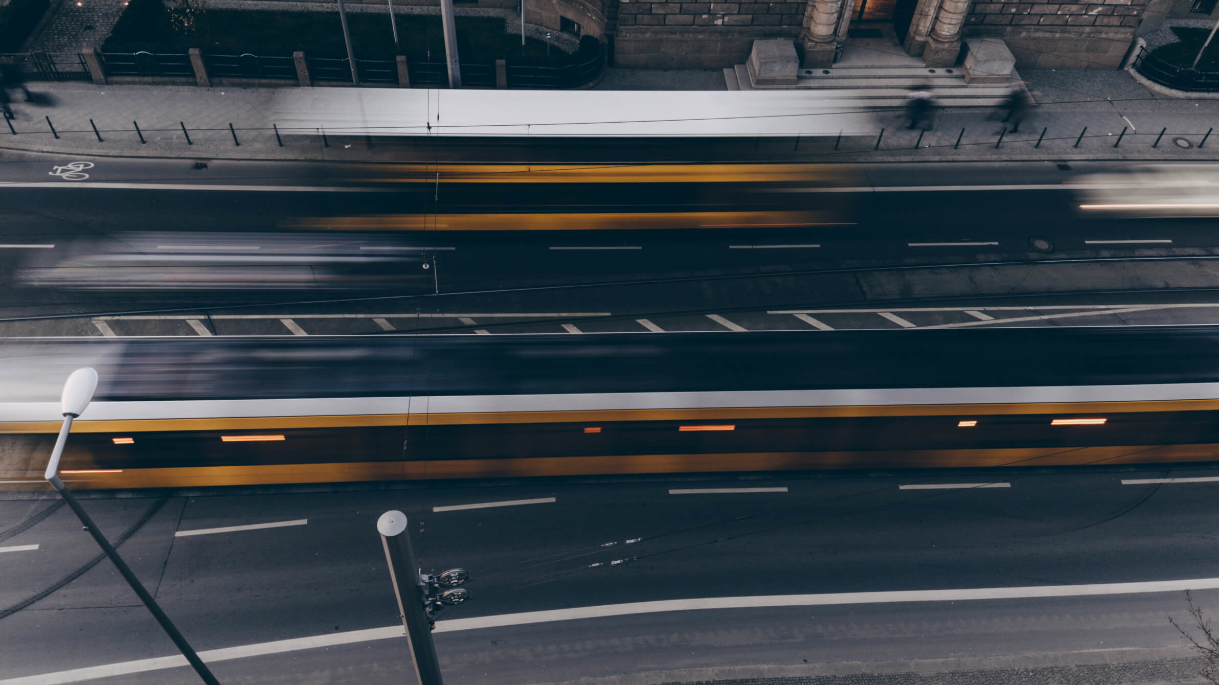 Overhead shot of a busy street with motion blur on the traffic