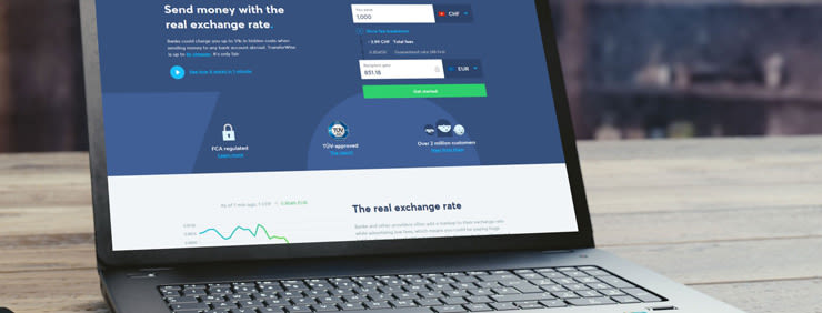 Laptop screen displaying a money transfer website.