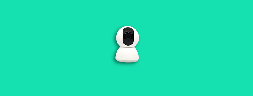 A white and black indoor security camera on a turquoise background.