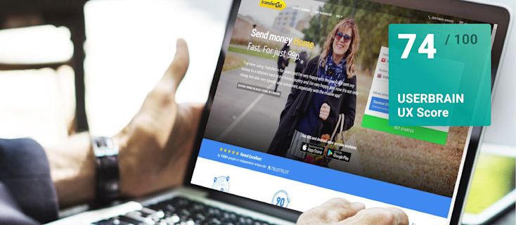 Screenshot of the TransferGo website on a laptop, with a Userbrain UX score overlay of 74/100.