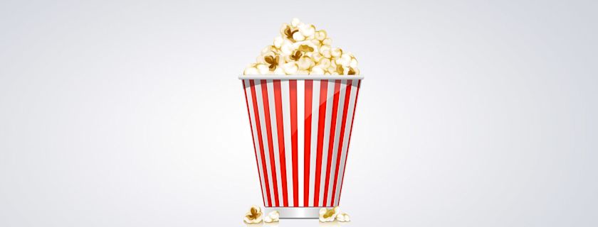 A container full of delicious popcorn, perfect for movie night.