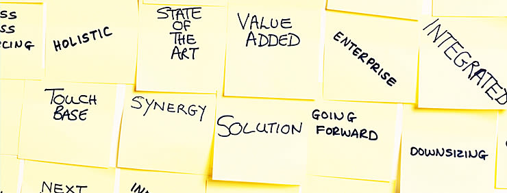 Post-it notes with business buzzwords like "Holistic", "Touch Base", "State of the Art", "Value Added", "Synergy", and "Integrated".