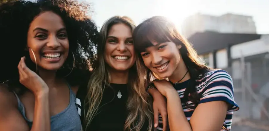 Three smiling teenagers