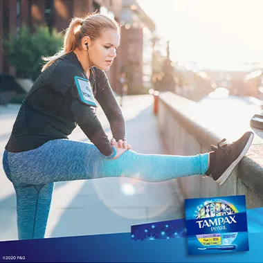 Young woman exercising outdoors with tampons Tampax Pearl TriplePack