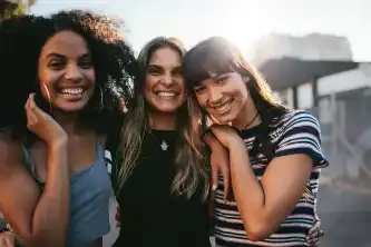 Three smiling teenage girls