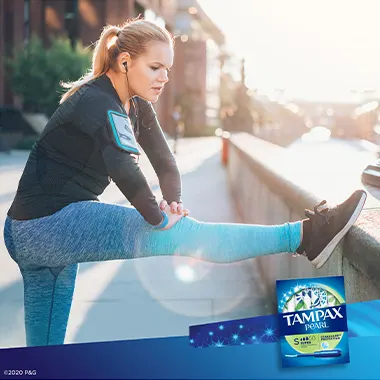 Young woman exercising outdoors with tampons Tampax Pearl Super