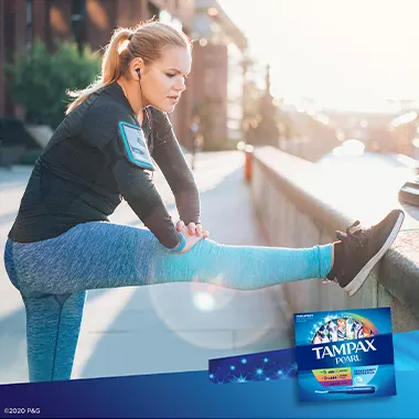 Young woman exercising outdoors with tampons Tampax Pearl TriplePack