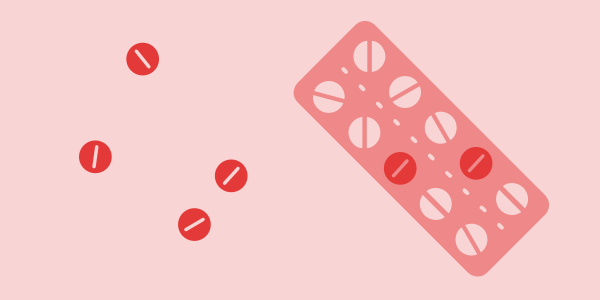 ilustration of a pill pad with empty slots and several pills lying next to it