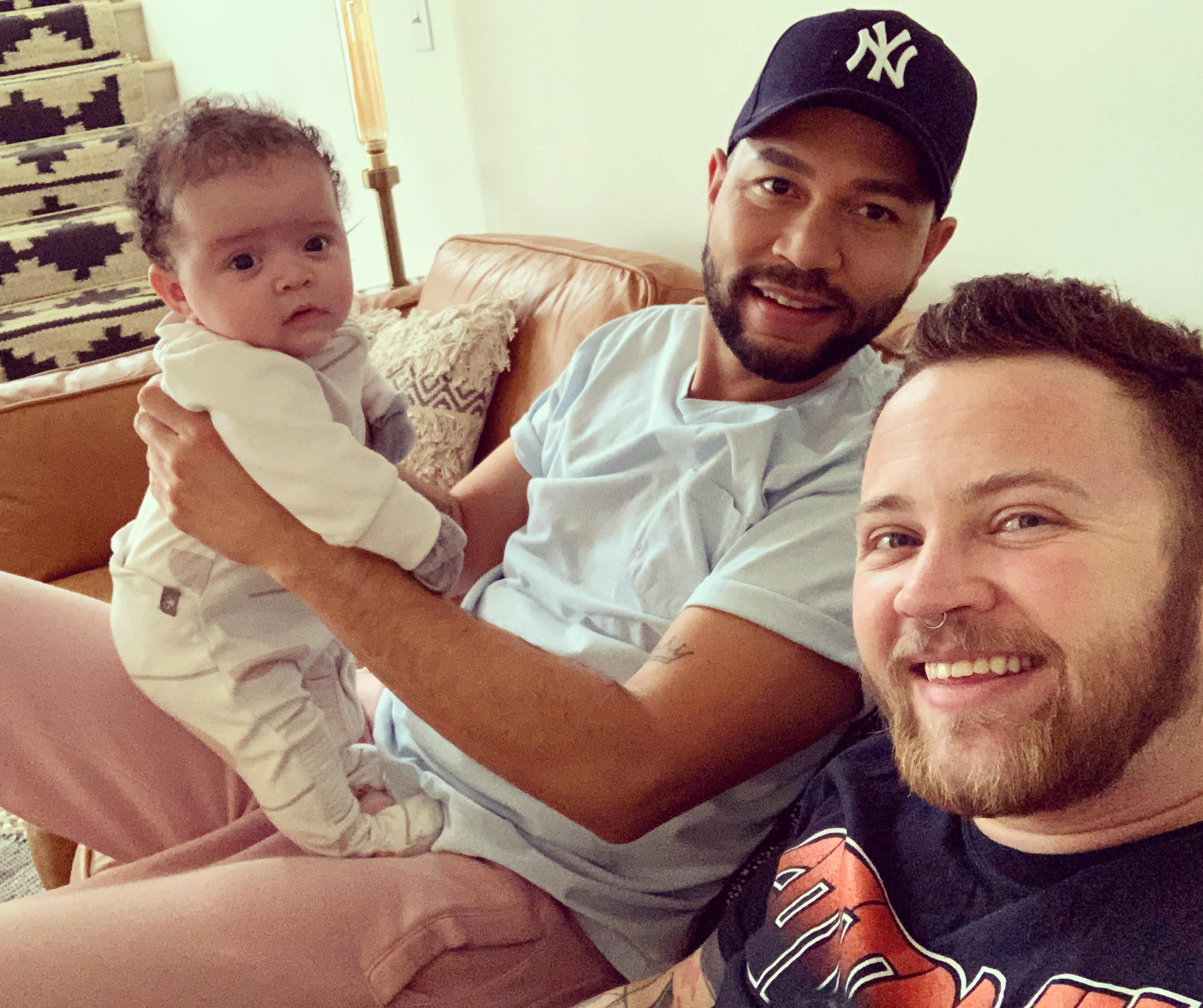 Bennett Kaspar-Williams and his husband with their baby. 