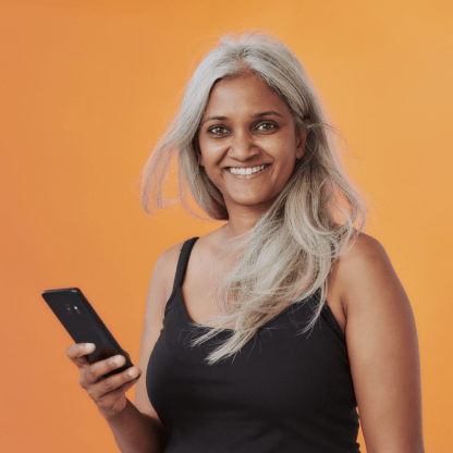 An image with an orange background and a person holding a phone