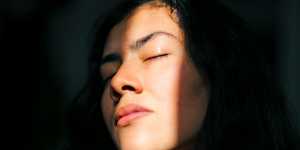 person with their face half in shadows with some sunlight