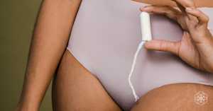 Woman holding a tampon