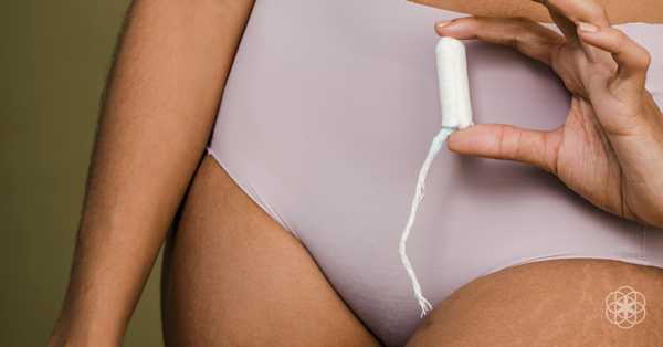 Woman holding a tampon