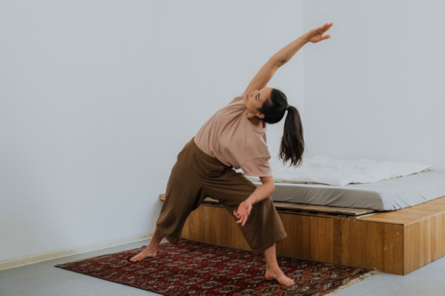 an image of a person in a side stretch yoga position