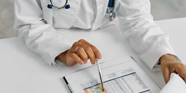 doctor with a pen and clipboard