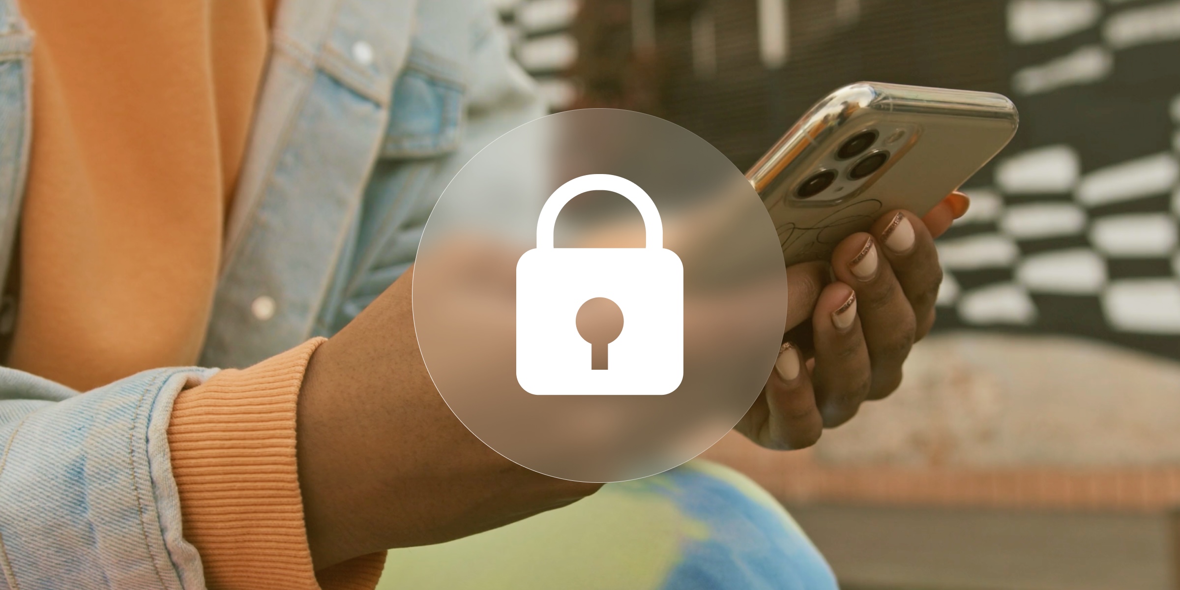 A person holding their phone with a padlock image overlay