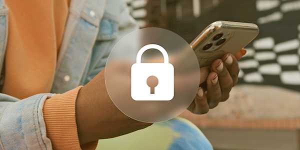A person holding their phone with a padlock image overlay