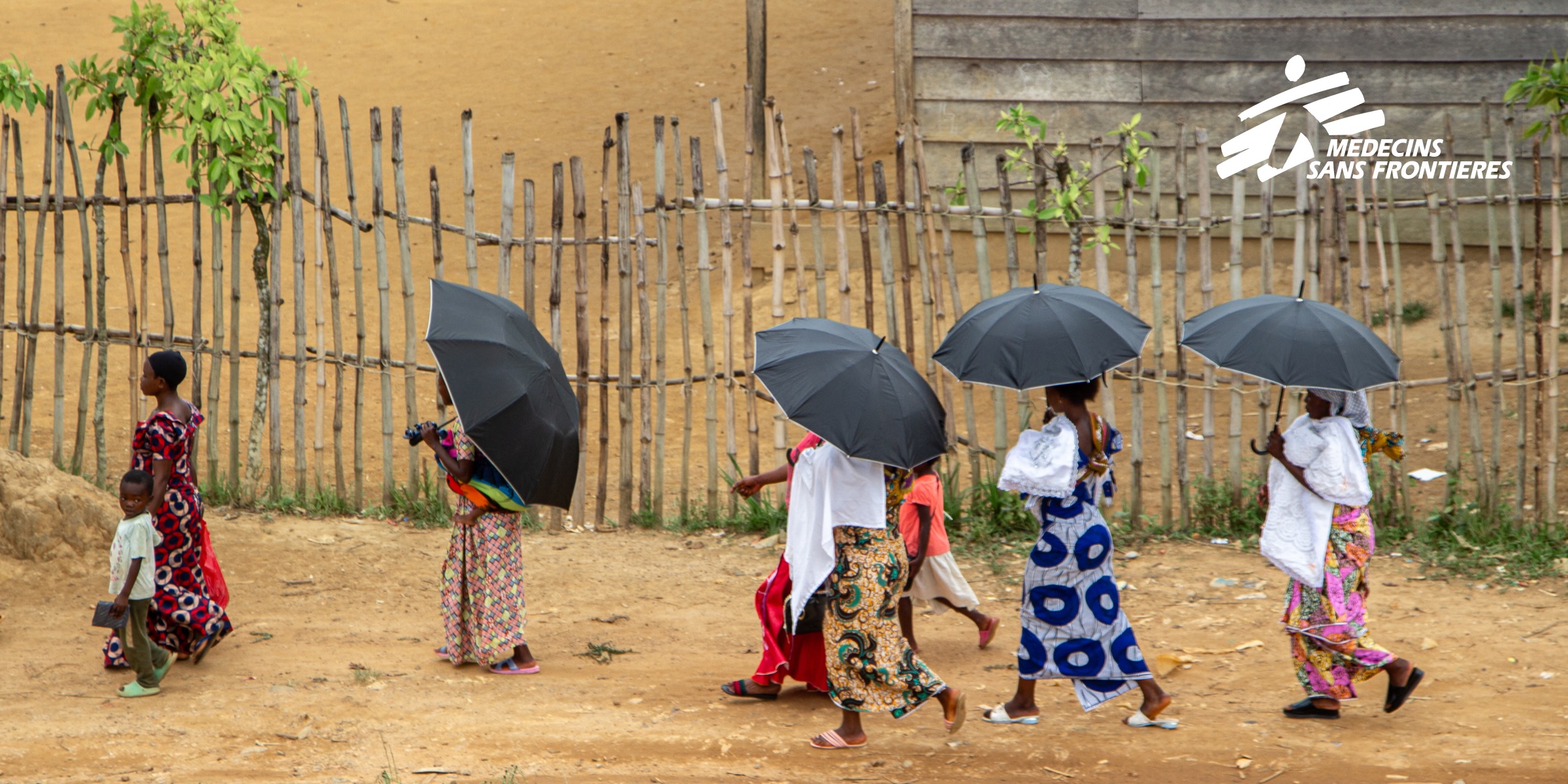 image of women in the DRC walking and with the MSF logo in the top right corner 