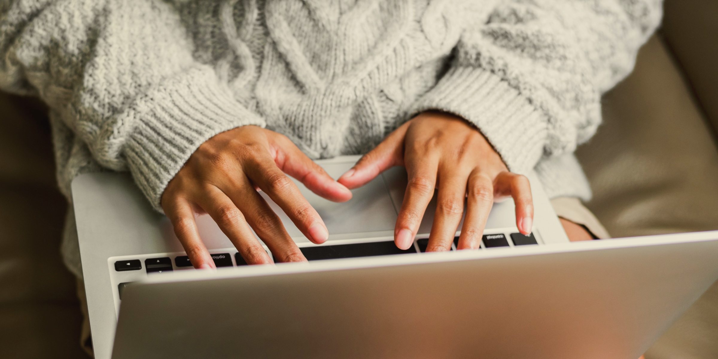 close up of a woman working on her laptop