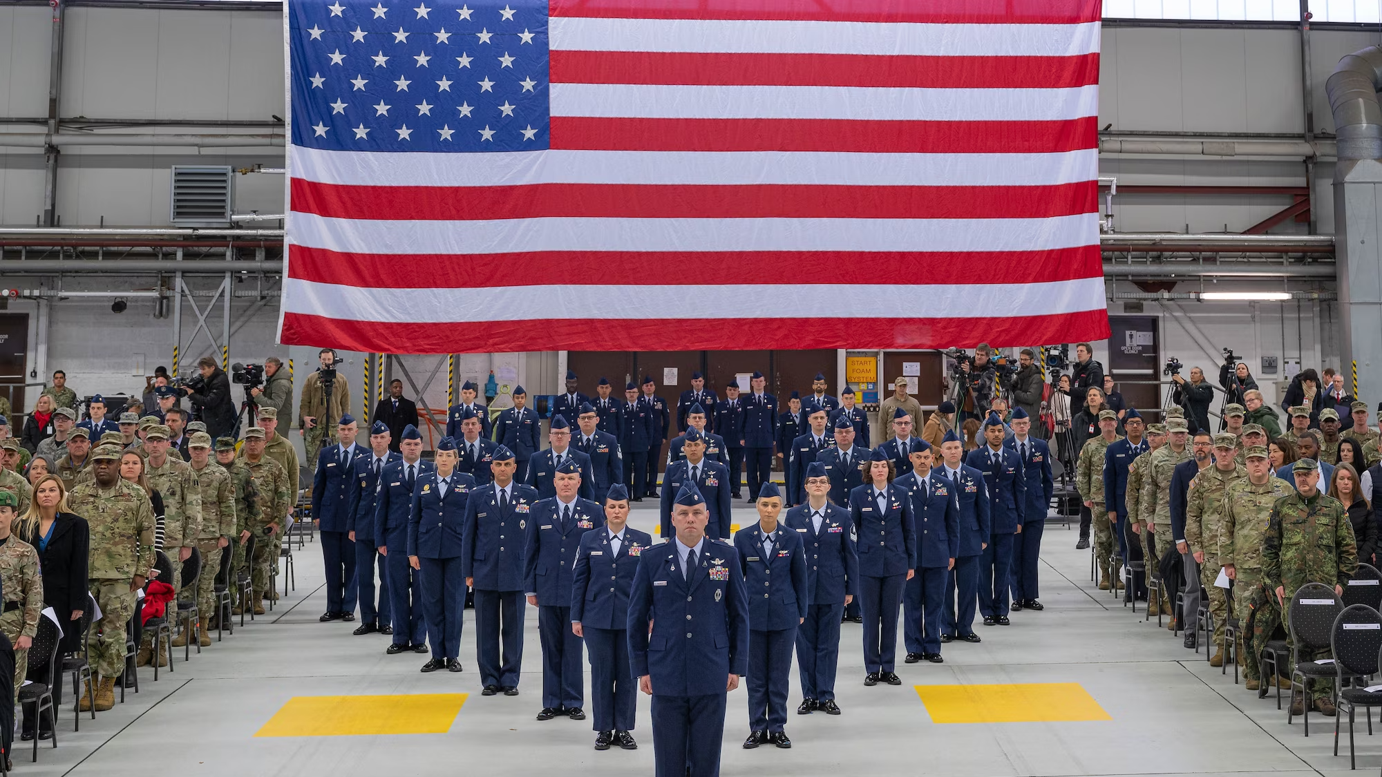 U.S. Space Force Guardians assigned to U.S. Space Forces Europe and Africa stand in a delta formation at Ramstein Air Base, Germany, Dec. 8, 2023. USSPACEFOR-EURAF provides U.S. European and Africa Commands a cadre of space experts who will work with NATO Allies and partners to integrate space efforts into shared operations, activities and investments — enhancing security and stability, and advancing key partnerships in the regions. (U.S. Air Force photo by Senior Airman Madelyn Keech)