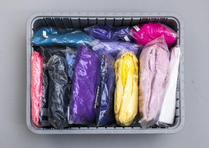 Tightly packed apparel in transparent polybags