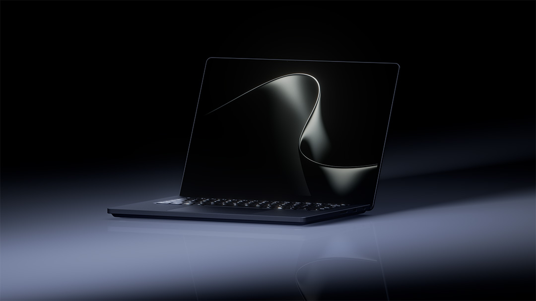 Black laptop with blue abstract screen on a reflective surface in a dark setting