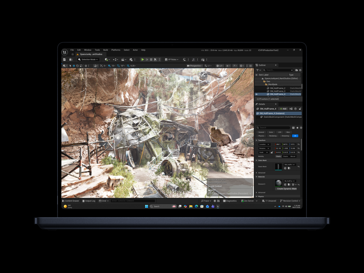 Game development workspace displaying a canyon scene with mechanical structures, cables and overgrown foliage