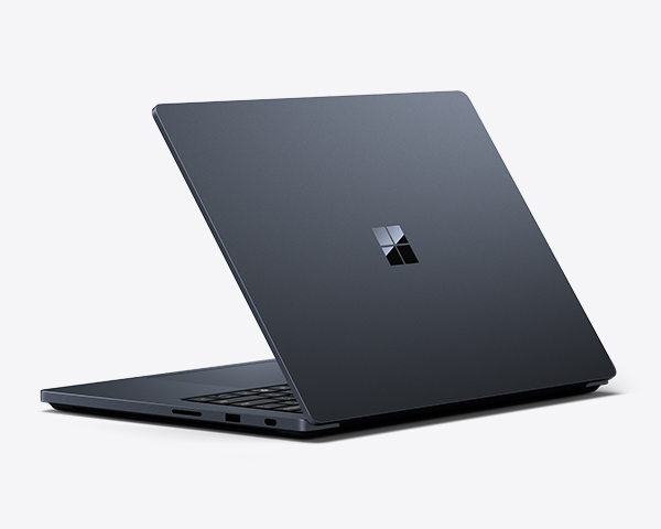 Black laptop shown from the back side of the device and at an angle, slightly closed