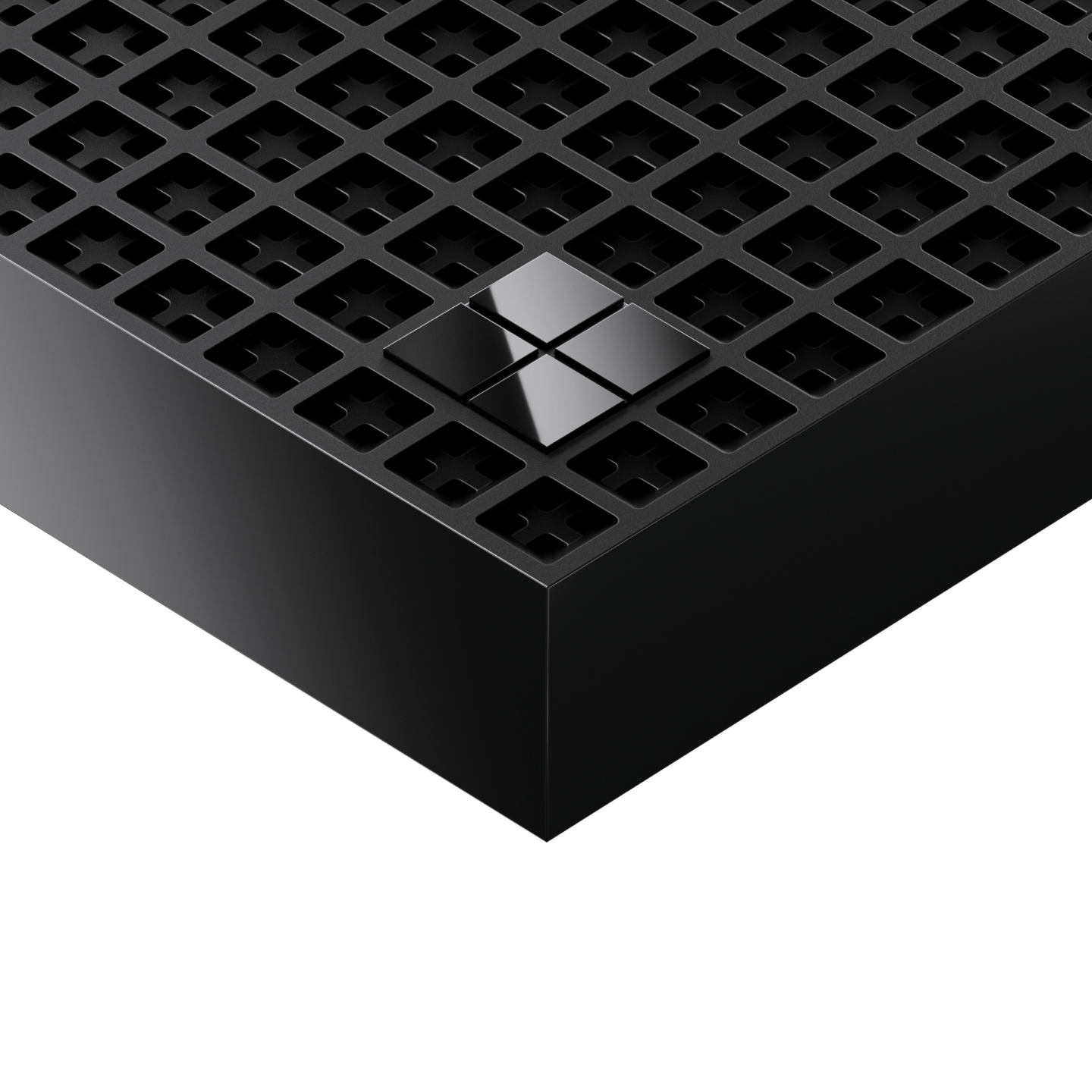 Close-up of black device with perforated grid and logo