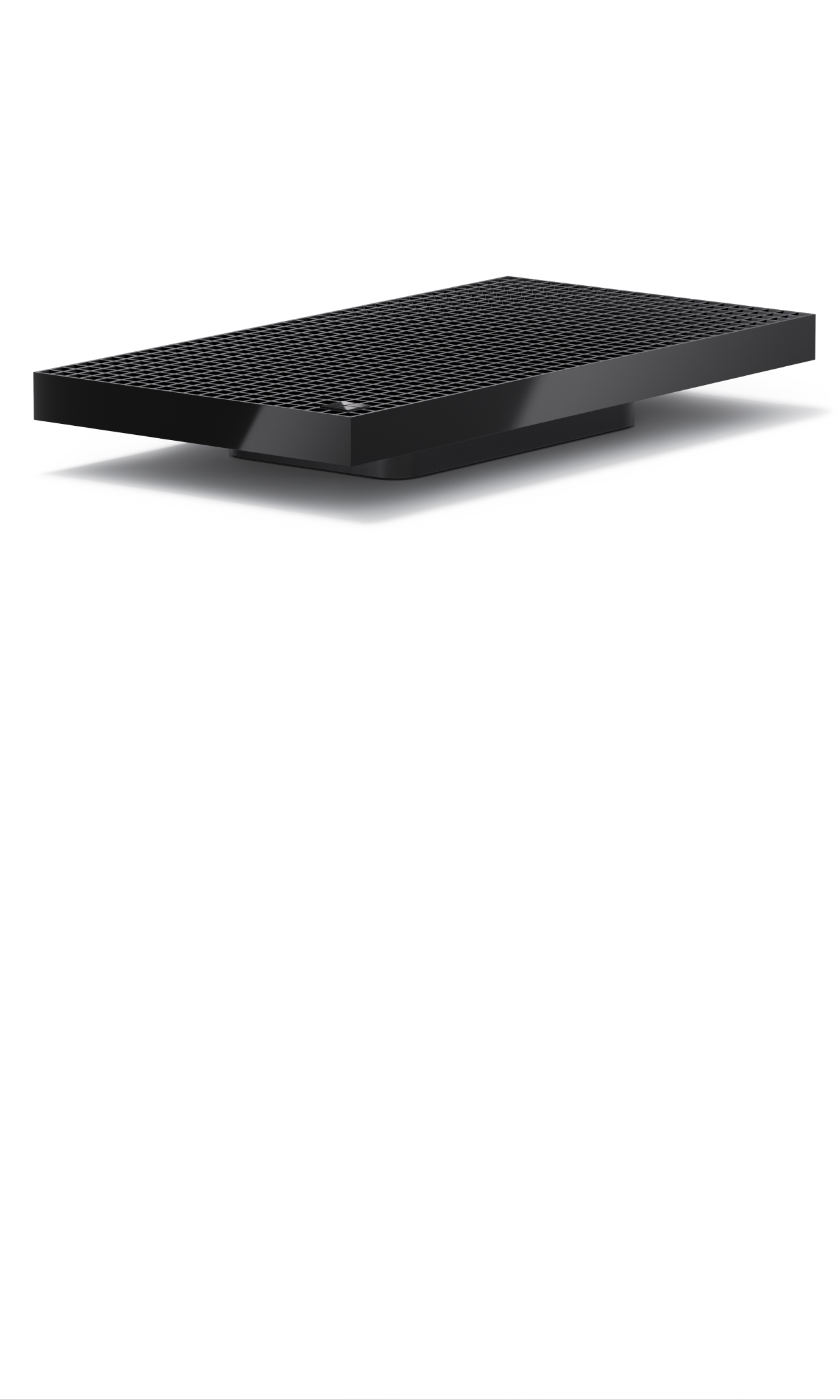 Black rectangular device with perforated top surface, shown at an angle on a light background