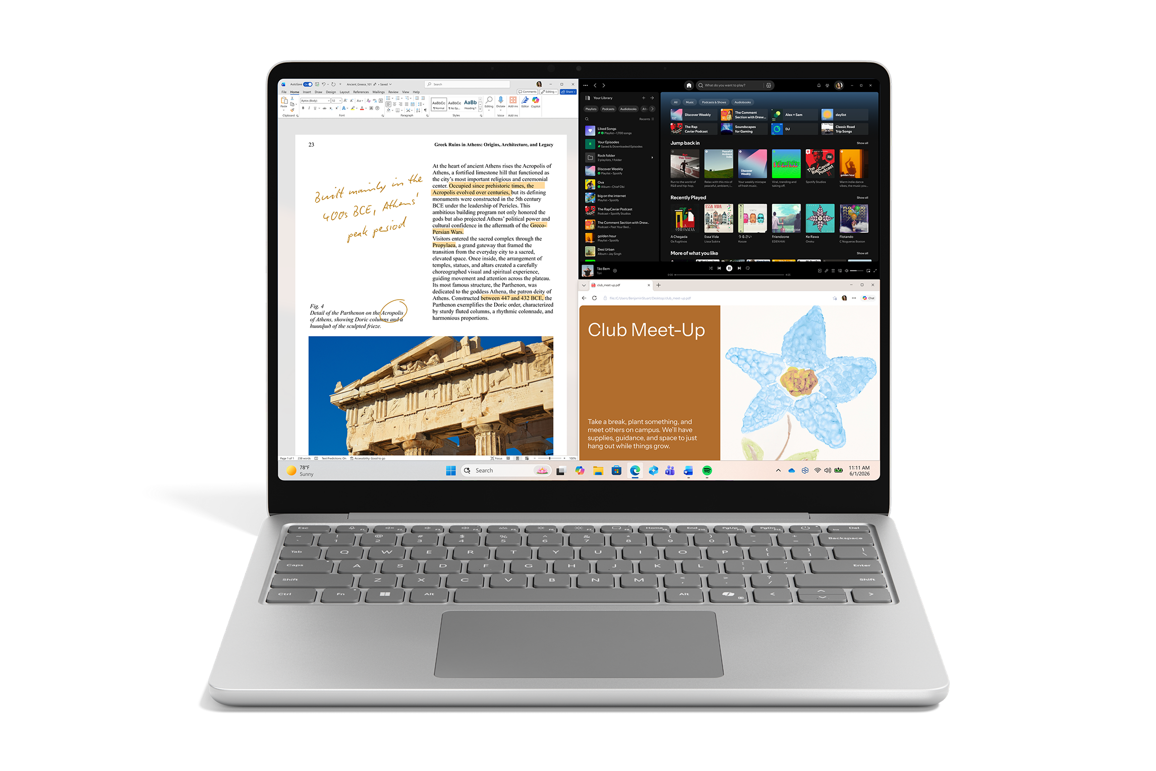 Platinum 13-inch laptop displaying a split-screen view with document editing, music app and web content