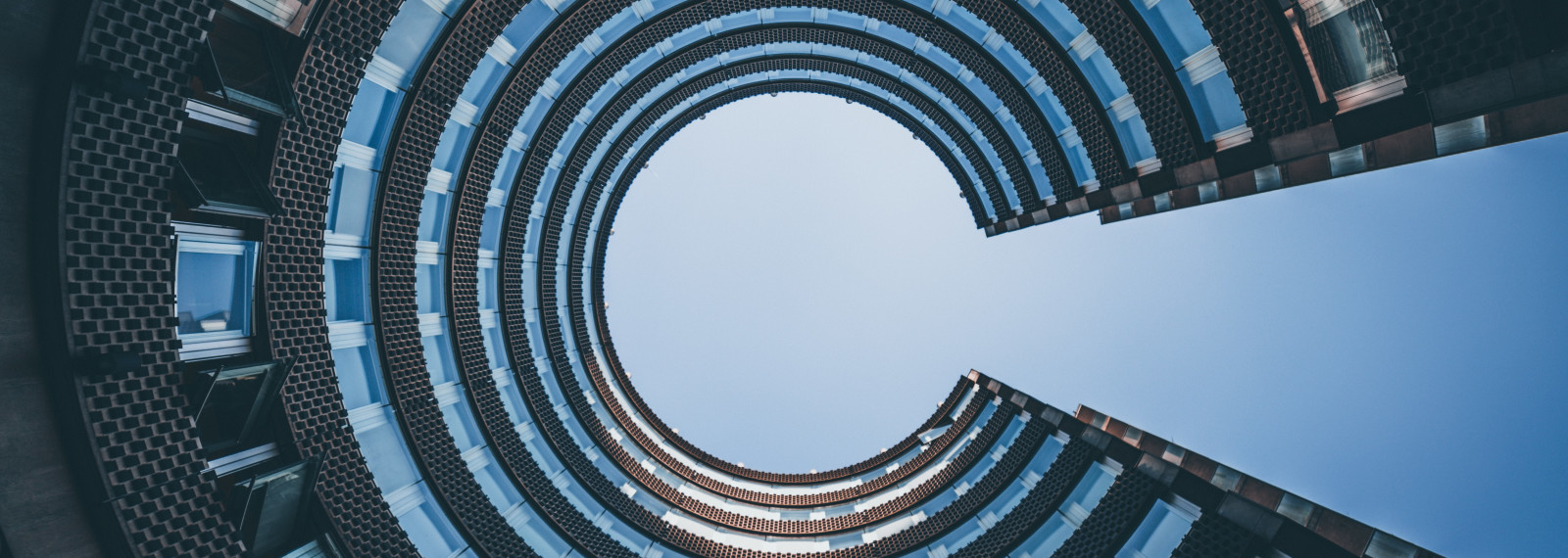 Image of looking up to the sky from within a circular building