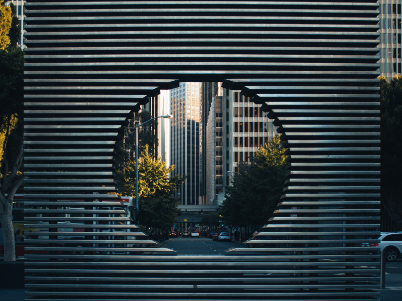 Image looking through a circle to a cityscape