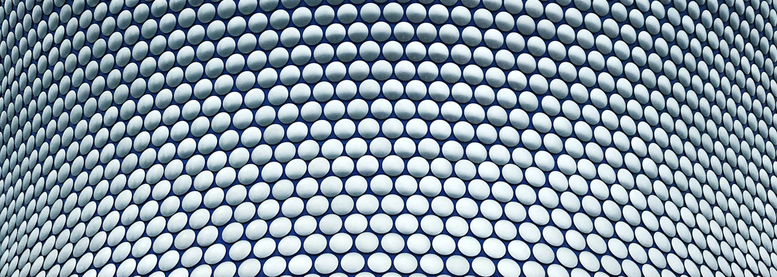 Image of close up of building with interlocking circular pattern on façade