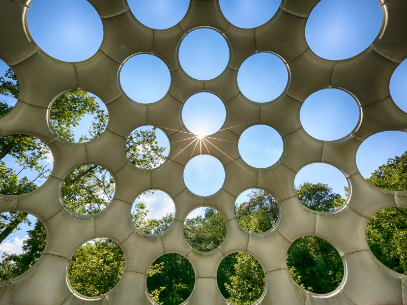 Image looking out to the world through a series of circular portholes