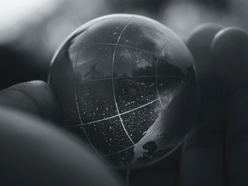 Image of a transparent globe held in a hand