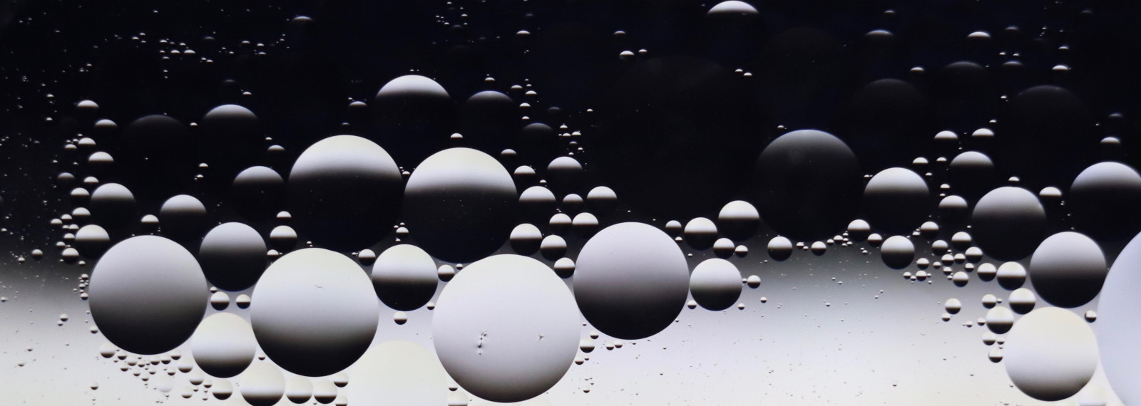 Image of circular droplets of water depicting light and shade