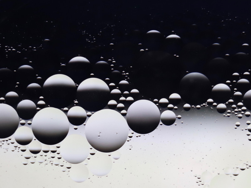Image of circular droplets of water depicting light and shade