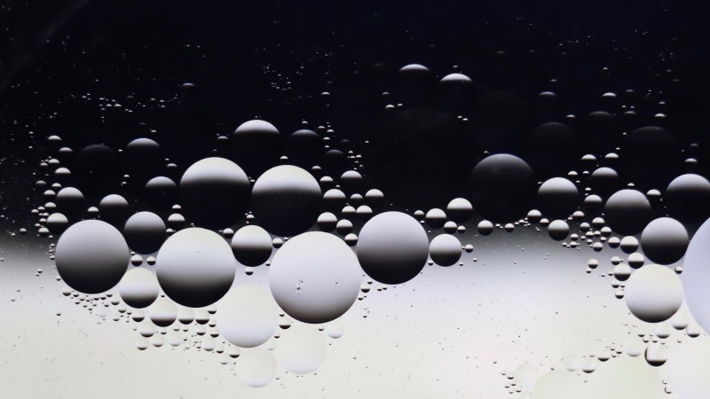 Image of circular droplets of water depicting light and shade