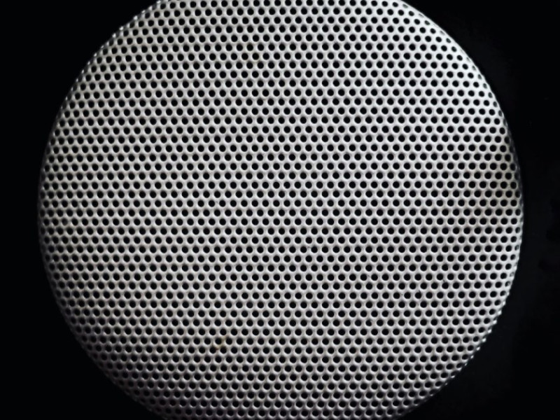 Close up of circular object with perforations 