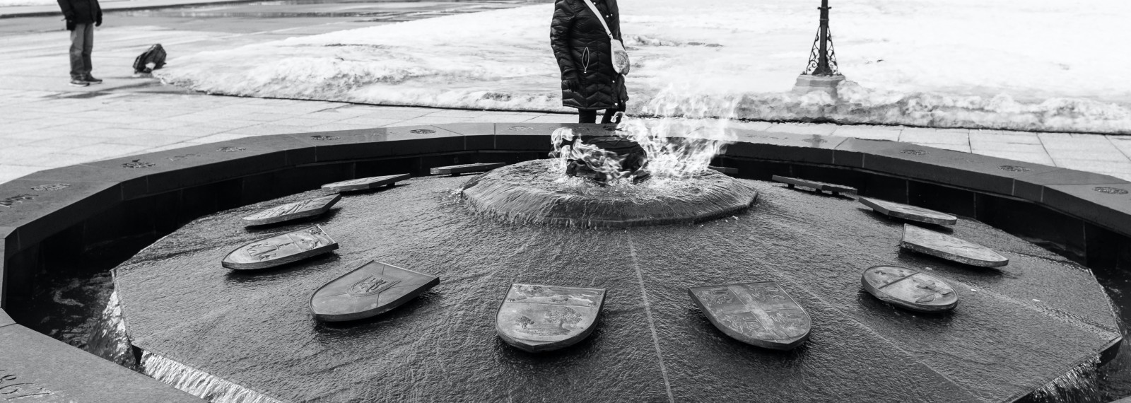 image of a close up of a circular fountain in a pedestrian square