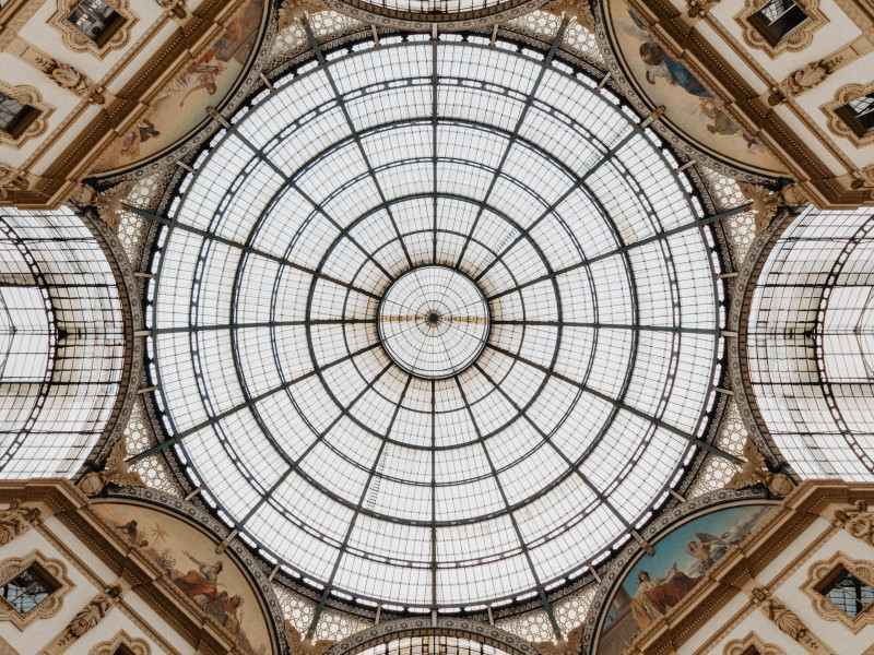 Image looking up towards a circular roof window