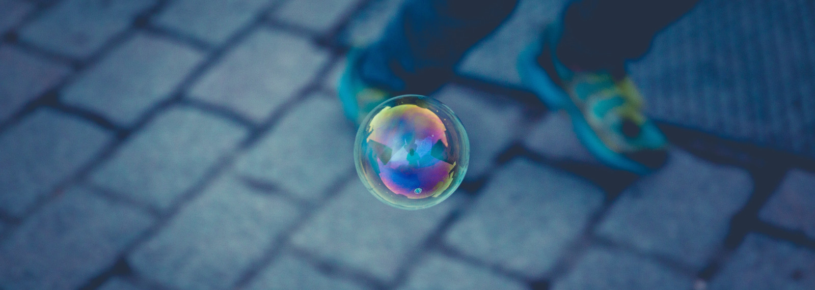 Image looking down a bubble floating through the air
