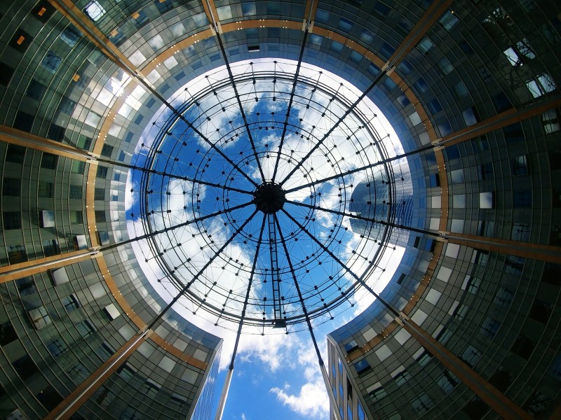 Image looking up at the sky through a circular building