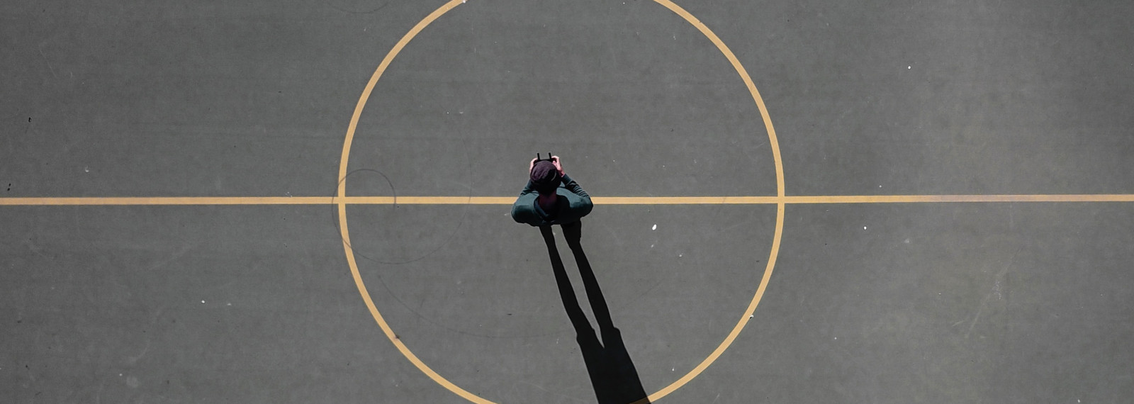 Image looking down on a center circle on a sports pitch