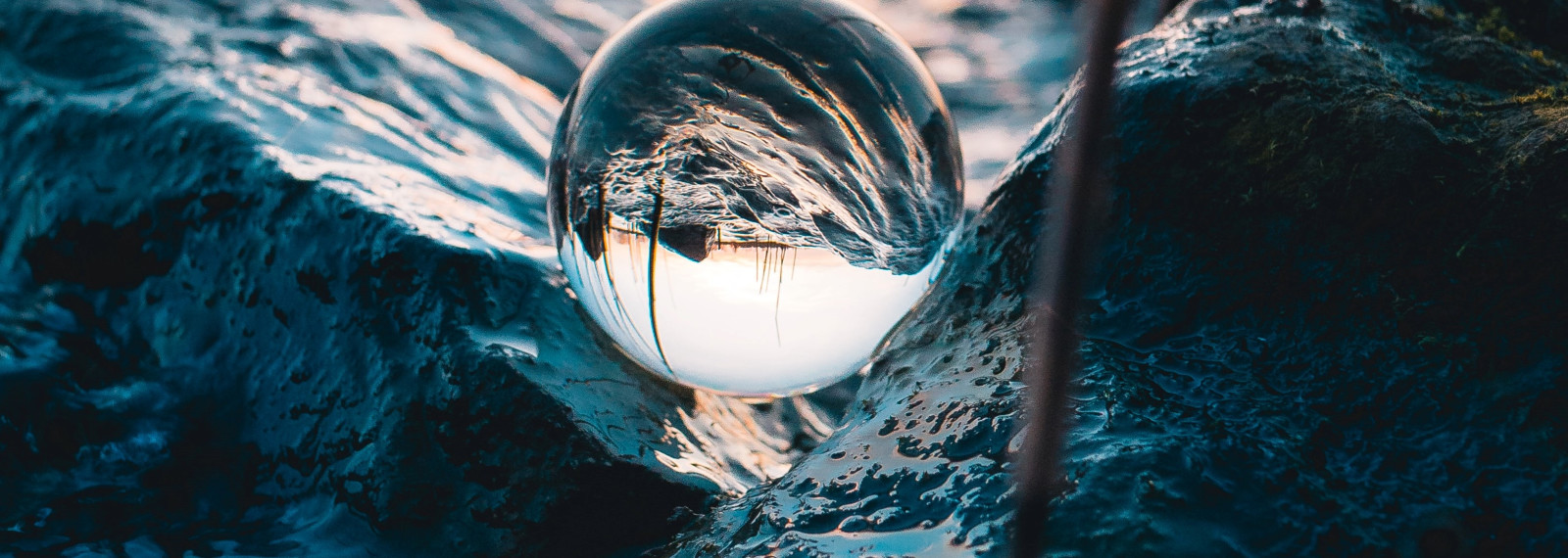 Image capturing a circular water bubble in waves