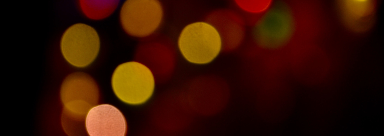 image of a close up of out of focus lights against a dark background