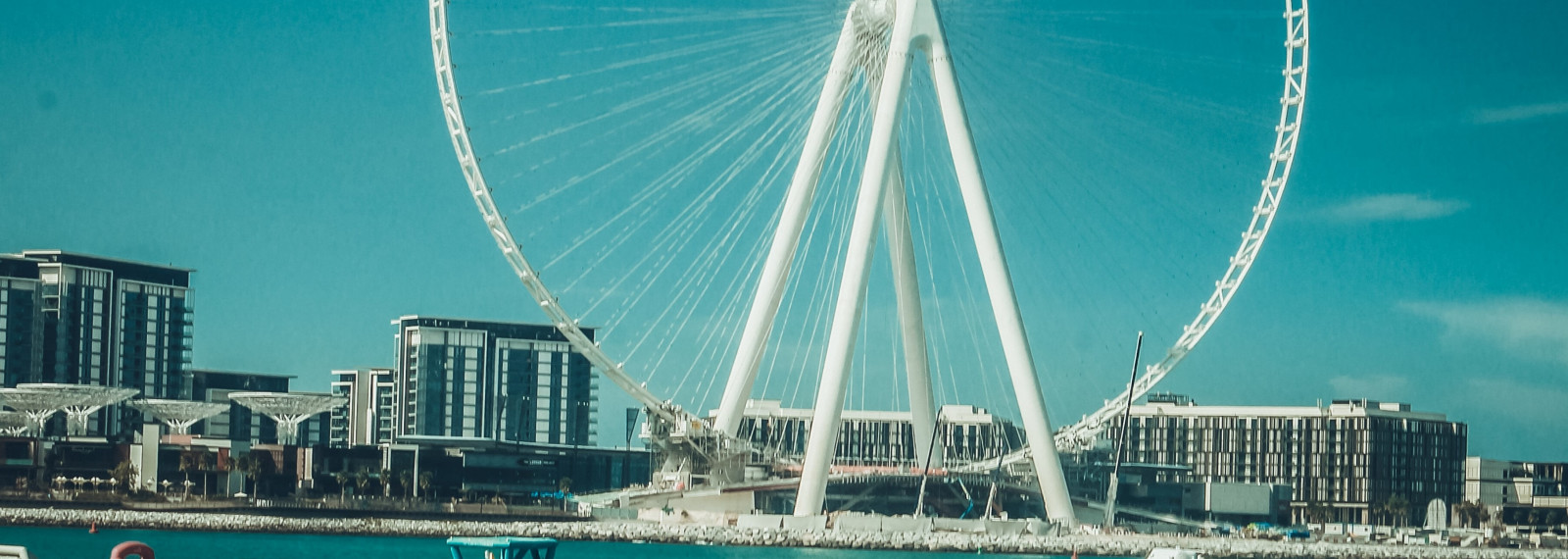 Image of a view of a Ferris wheel from a beach