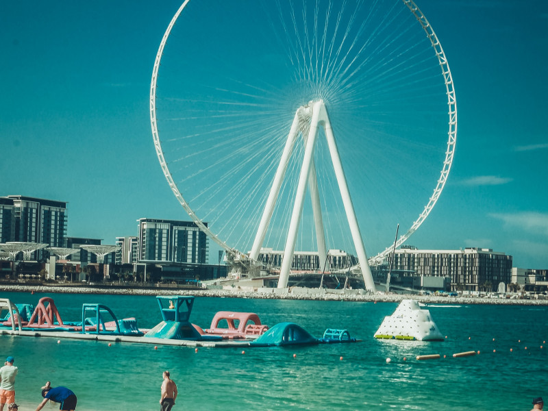 Image of a view of a Ferris wheel from a beach