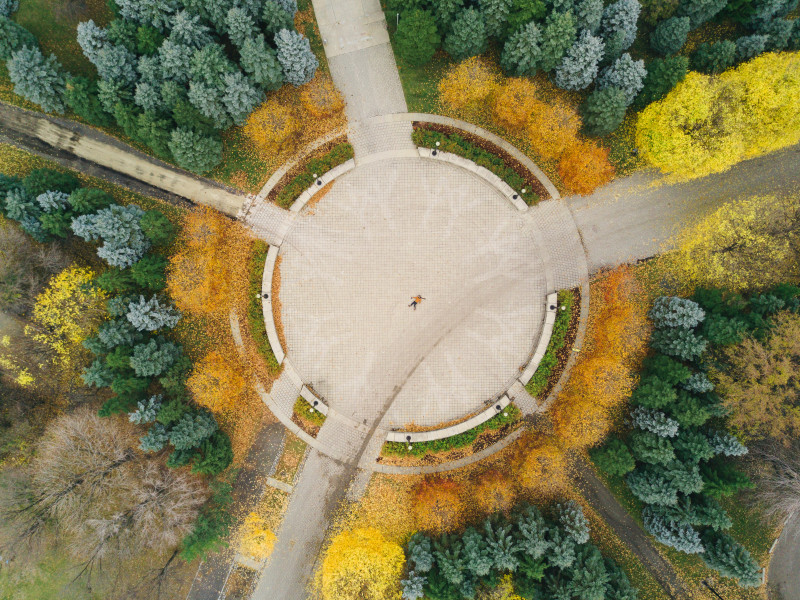 Aerial video of a circular structure surrounded by trees